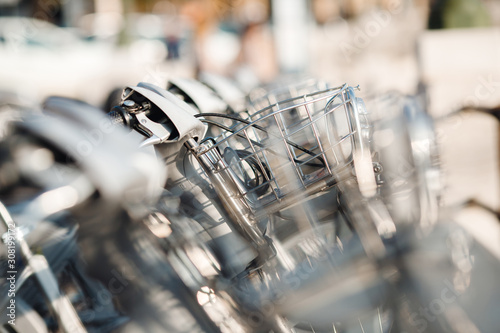 Share bike with metal rental basket, blurred background photo