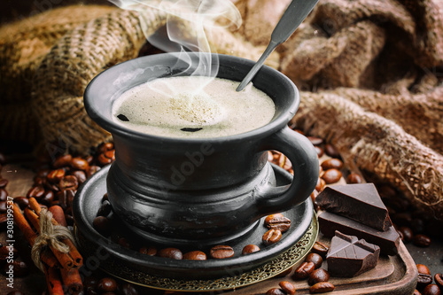 Black coffee on an old background in a cup