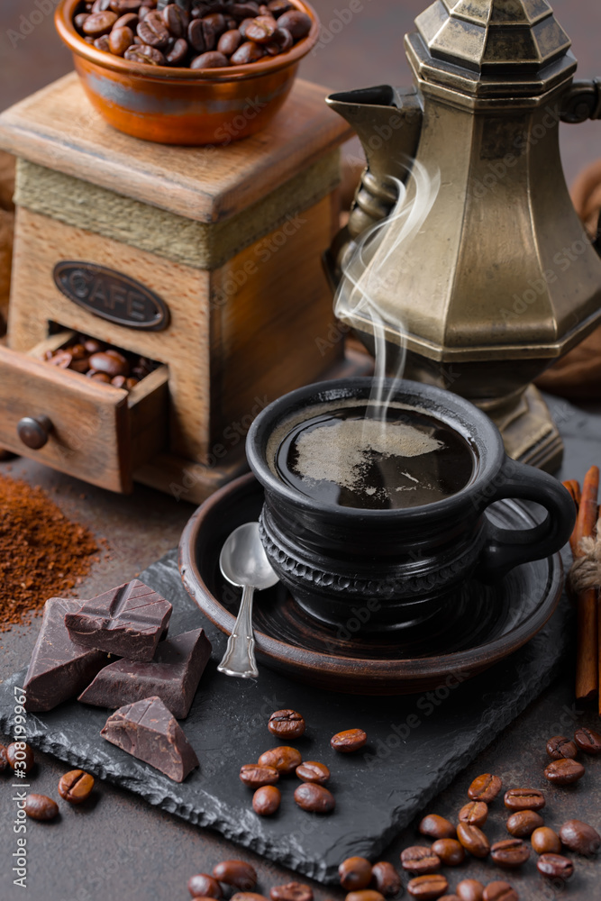 Coffee in a cup and saucer on an old background. Coffee in a cup and saucer on an old background.