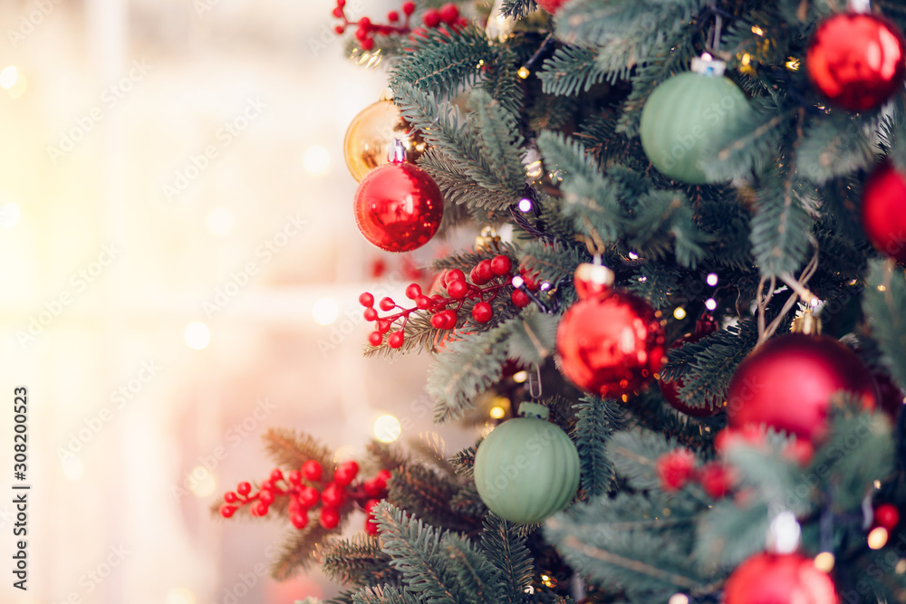 Christmas background pine tree branch with decorations red balls gifts and star, with bokeh light Christmas background pine tree branch with decorations red balls gifts and star, with bokeh light