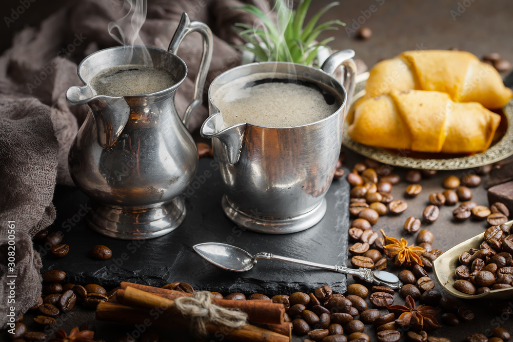 Coffee in a cup and saucer on an old background. Coffee in a cup and saucer on an old background.