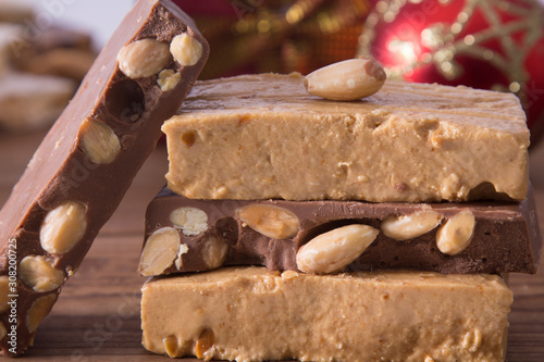 nougat, typical Christmas dessert on wooden background