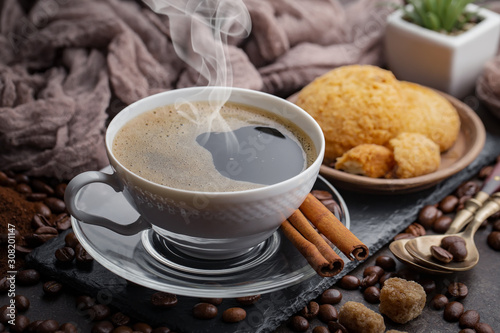 Coffee in a cup and saucer on an old background.