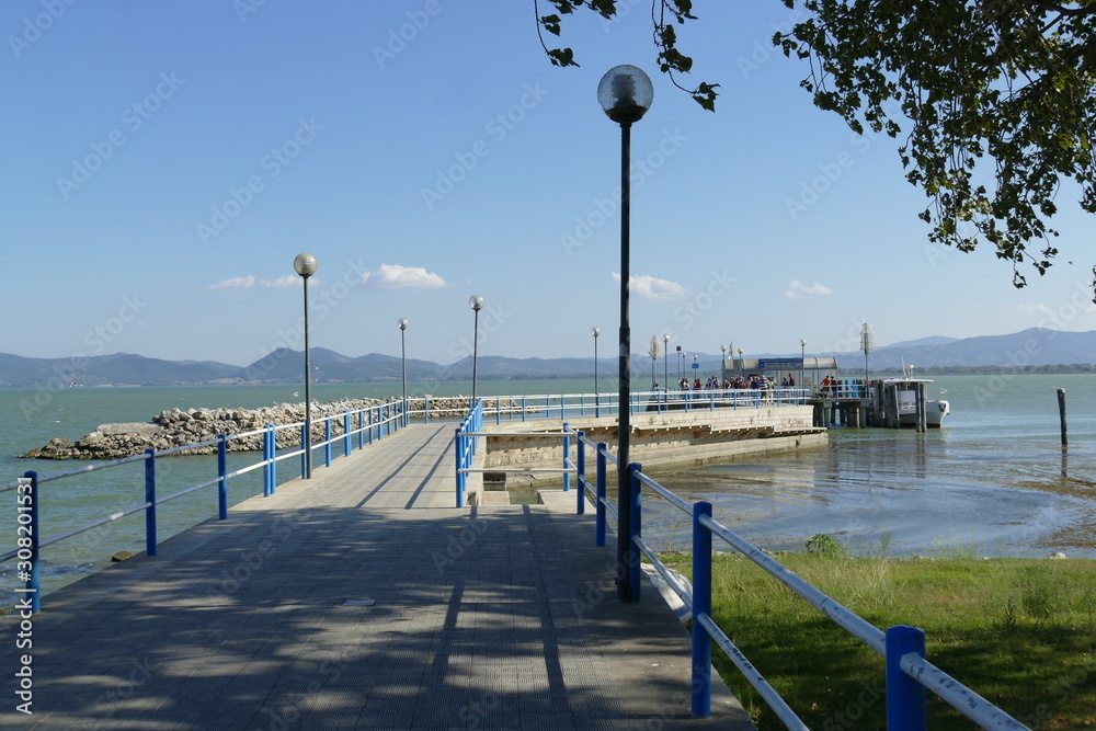 pier for ferries to Maggiore Island and Polvese Island in the lakeside of Castiglione del Lago on Trasimeno Lake.