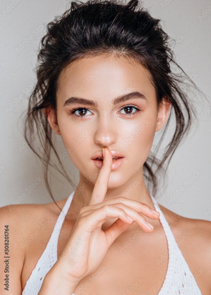 portrait of beautiful model on a grey background in the studio portrait of beautiful model on a grey background in the studio