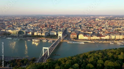 Vertical aerial panning shot of the city skyline of Budapest, Hungary at sunset. photo