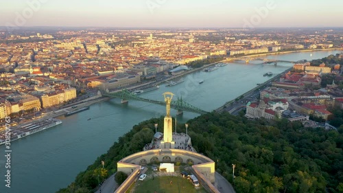 Aerial footage of the Liberty Statue in Budapest, Hungary. The statue stands on the Citadella, an iconic fortress of the once-conflict-driven city.
