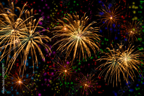 Colorful fireworks celebration on colorful star background.