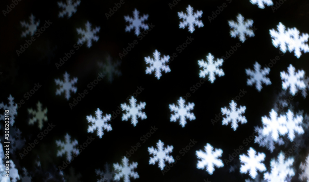Bright snowflakes bokeh background. Happy new year Bright snowflakes bokeh background. Happy new year
