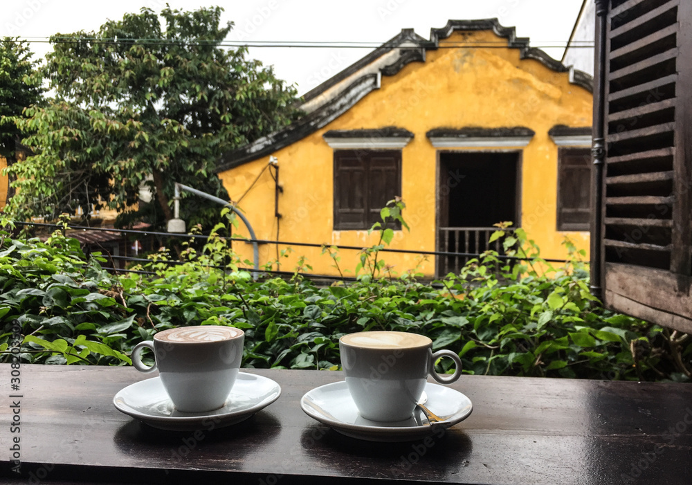 Fototapeta premium Cup of coffee on the wooden window