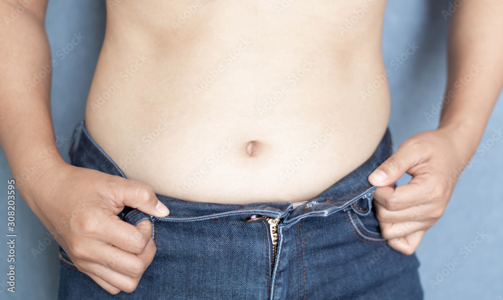 Naklejka premium Closeup abdominal surface woman fat, healthy care and beauty concept