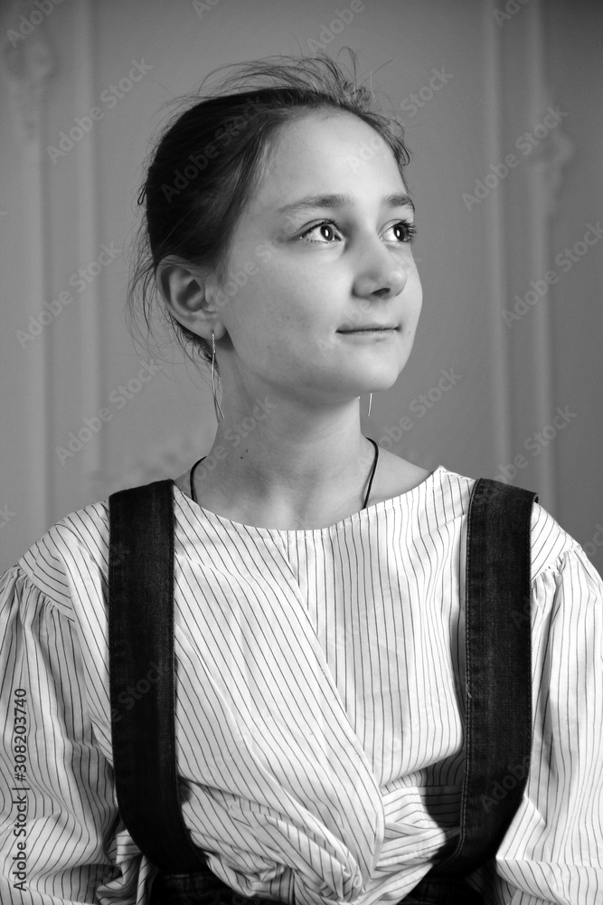 Portrait of little brunette caucasian girl in casual clothes