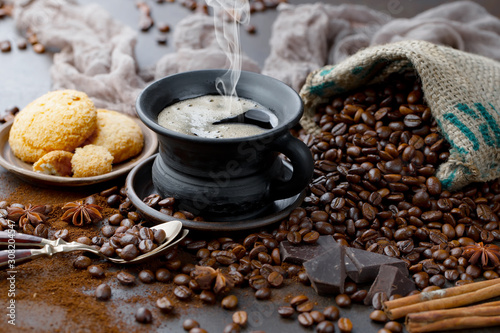 Coffee in a cup and saucer on an old background.