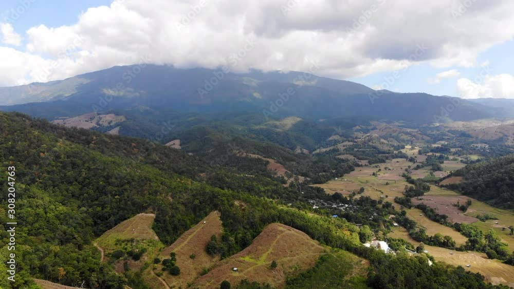 Aerial view scenic landscape of tropical forest and mountain against a blue sky, Drone shot Aerial view scenic landscape of tropical forest and mountain against a blue sky, Drone shot