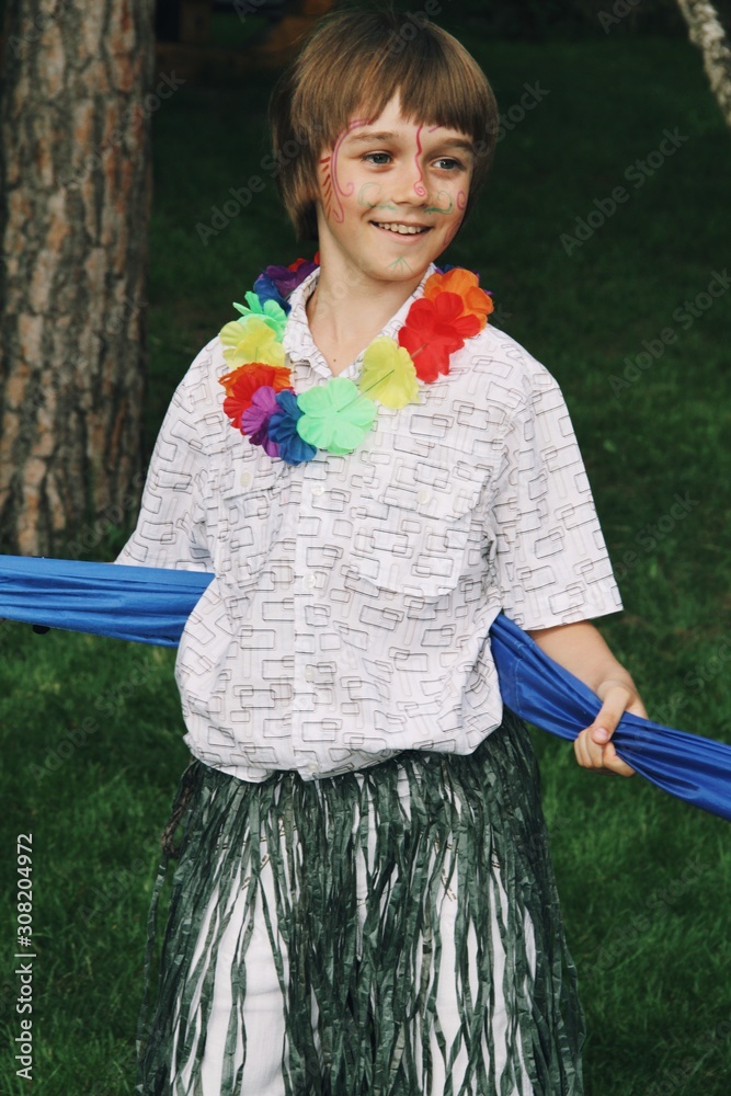 Portrait of little caucasian boy with make-up of fairy charachter