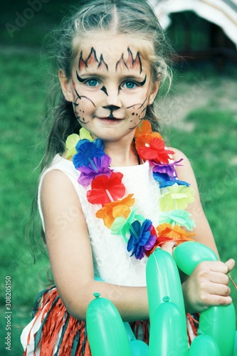 Portrait of little caucasian girl with bright fairy charachter make up