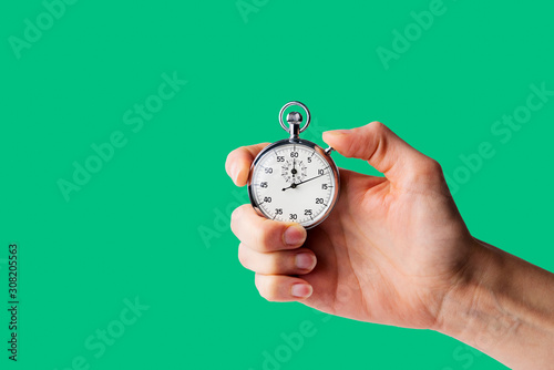 timer hold in hand, button pressed