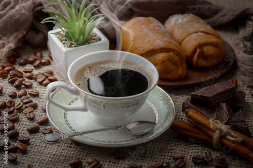 Black coffee on an old background in a cup