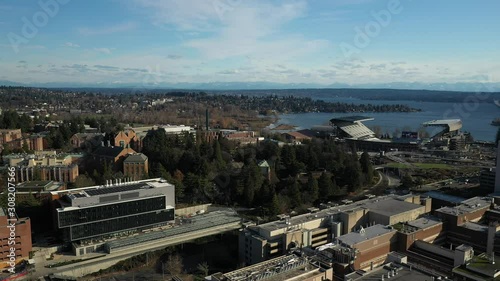 Drone footage of the University of Washington with the surrounding commercial and residential area, dormitories and classroom buildings in the background photo