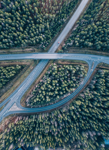 beautiful Aerial view of highway and overpass with green woods in Finland near Helsinki