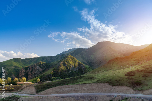 Majestic green mountains landscape during sunrise