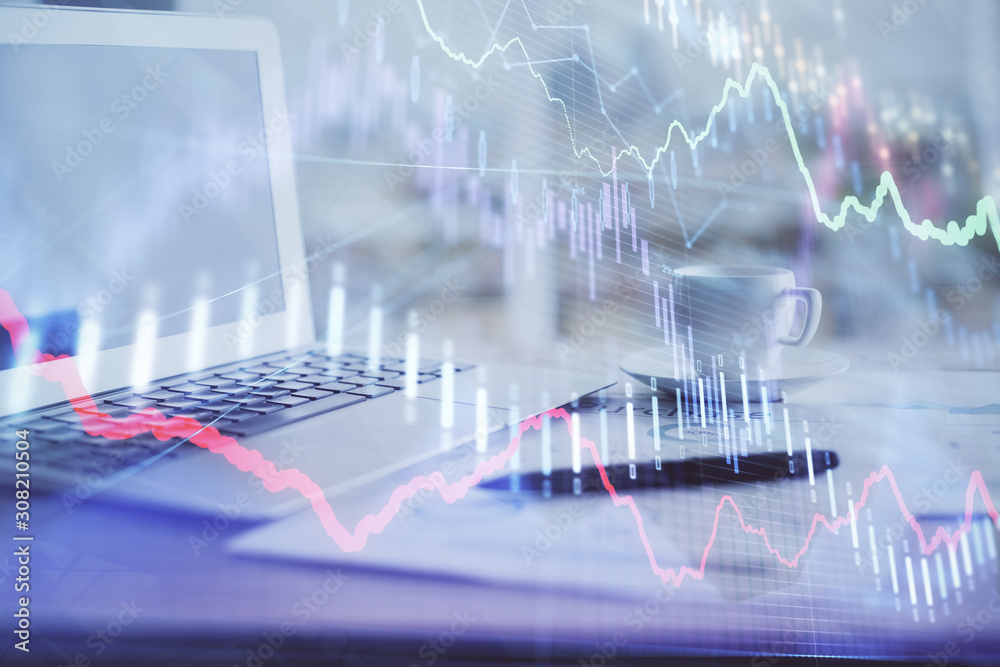 Forex graph hologram on table with computer background. Double exposure. Concept of financial markets. Forex graph hologram on table with computer background. Double exposure. Concept of financial markets.