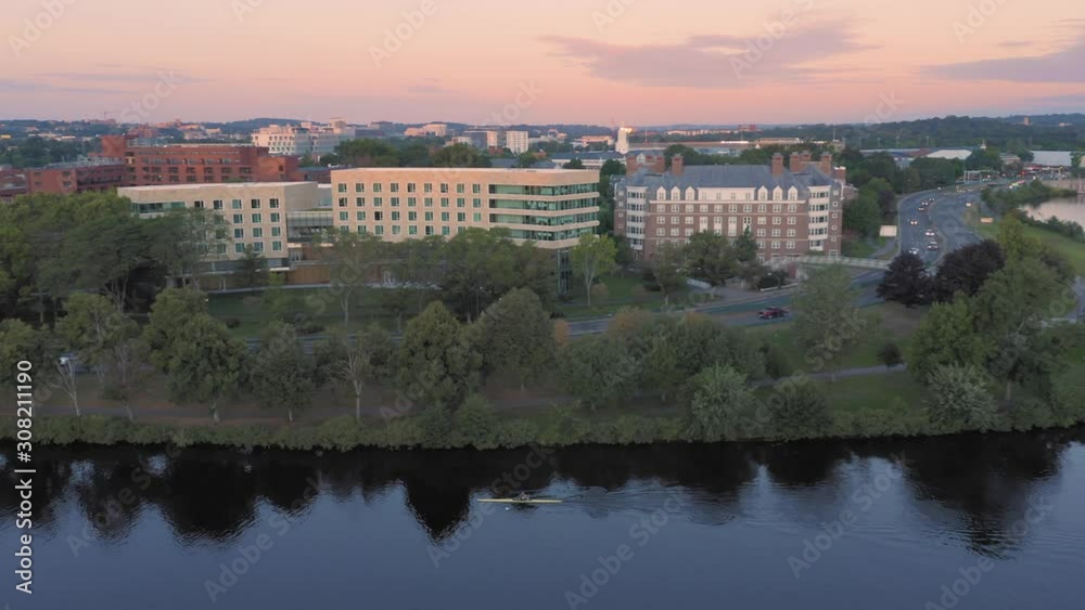 Aerial: Man rowing on the Charles River at Harvard University. Boston, Massachusetts, USA. 28 August 2019 Aerial: Man rowing on the Charles River at Harvard University. Boston, Massachusetts, USA. 28 August 2019