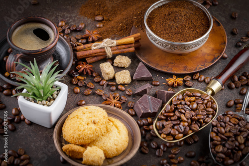 Coffee grains on a table with accessories for coffee