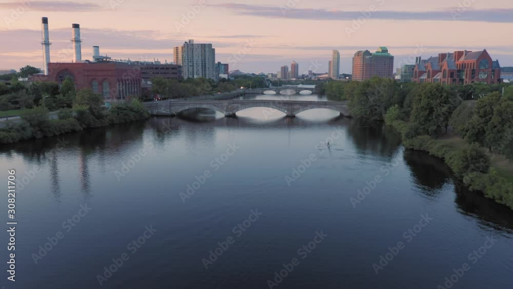 Aerial: Man rowing on the Charles River at Harvard University. Boston, Massachusetts, USA. 
