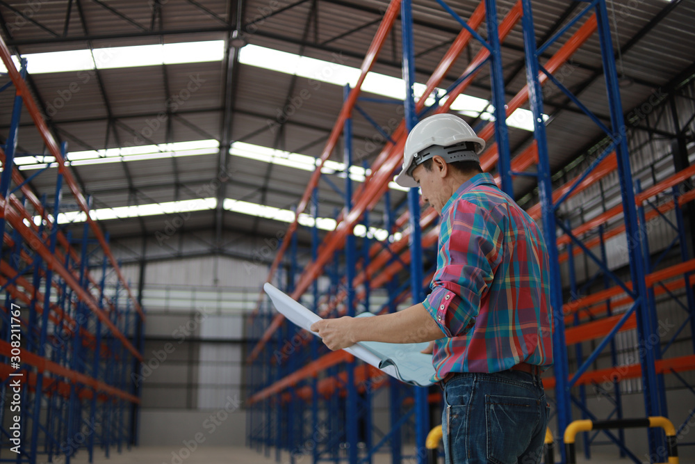 Asian Engineer man working in building factory