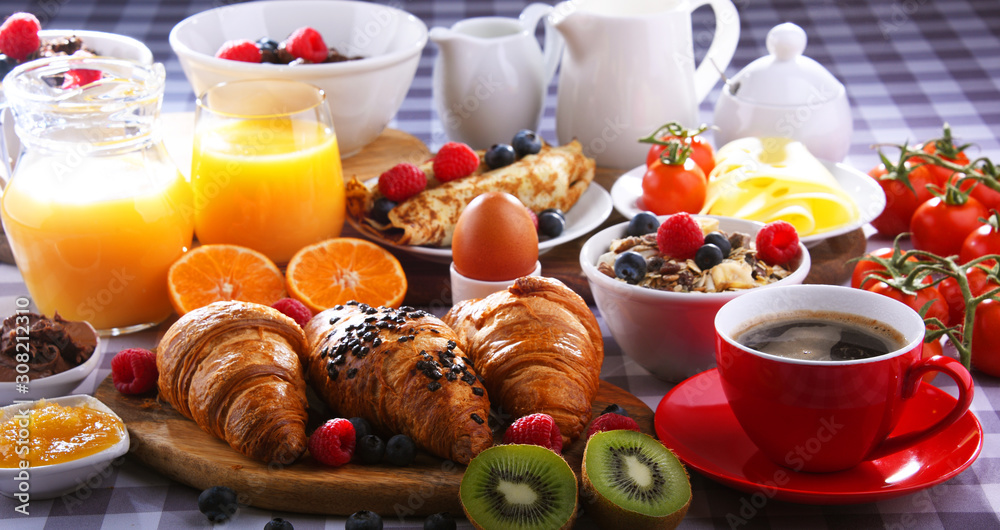 Breakfast served with coffee, juice, croissants and fruits Breakfast served with coffee, juice, croissants and fruits