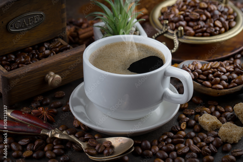 Fototapeta premium Black coffee on an old background in a cup