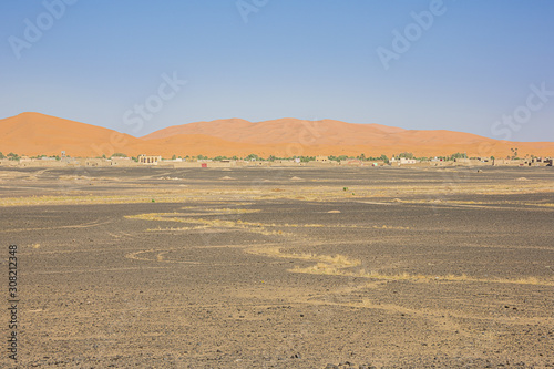 View of the sand dunes of Erg Chebbi with Merzuga in the foreground