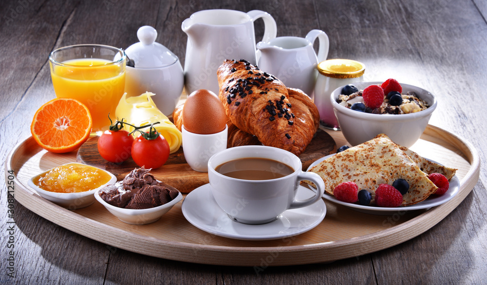 Breakfast served with coffee, juice, croissants and fruits Breakfast served with coffee, juice, croissants and fruits
