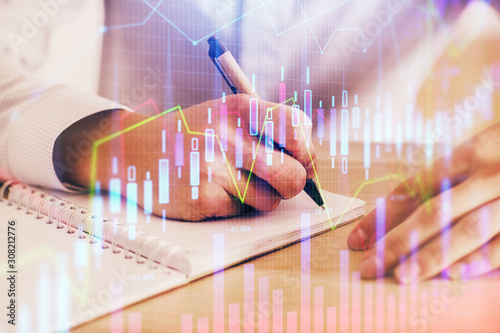 Multi exposure of man planing investment with stock market forex chart. © peshkova