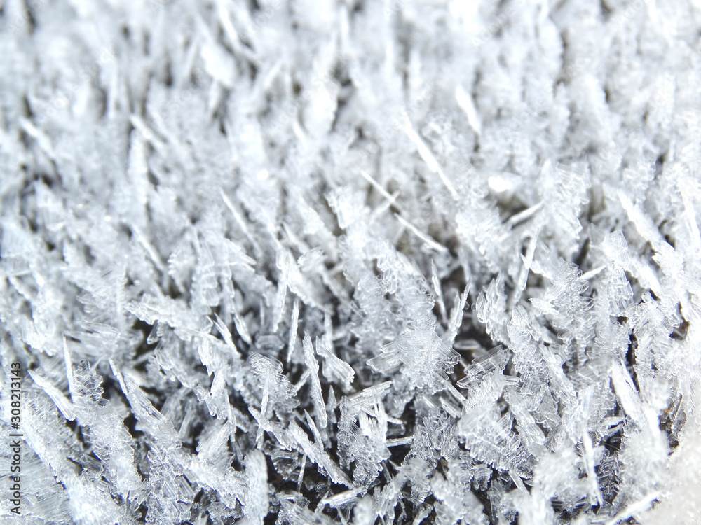winter background with snowflakes crystals patterns and snow on frozen grass winter background with snowflakes crystals patterns and snow on frozen grass
