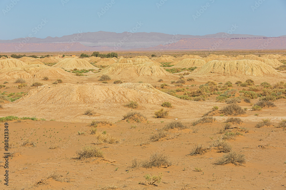 Several vertical access shafts to an underground canal for water supply on the road between Erfoud and Tinghir Several vertical access shafts to an underground canal for water supply on the road between Erfoud and Tinghir