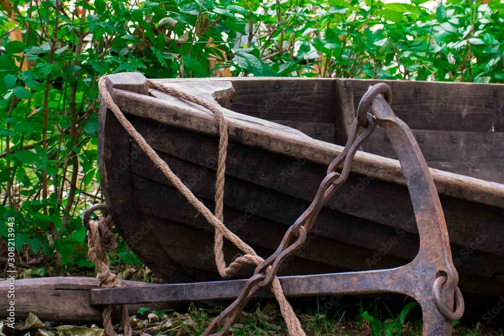 antique wooden boat with anchor