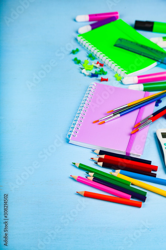 Items for the school on a wooden table.