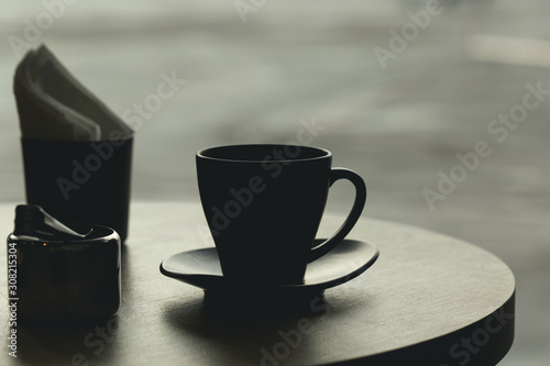 Cup of coffee on table at airport cafe