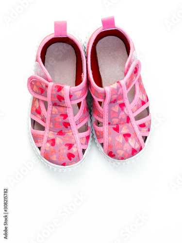 Cute pink baby girl shoes isolated on white background/ Top view