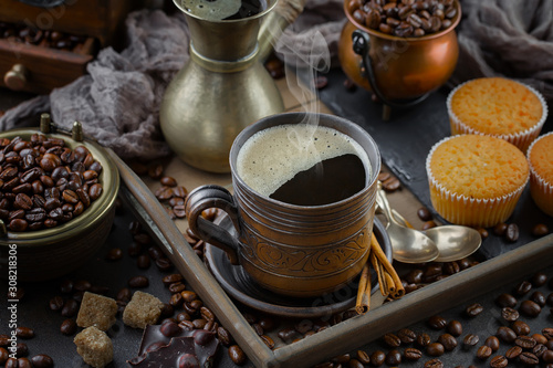 Black coffee on an old background in a cup