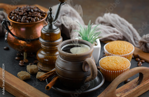 Coffee in a cup on a background of coffee beans  on an old background.
