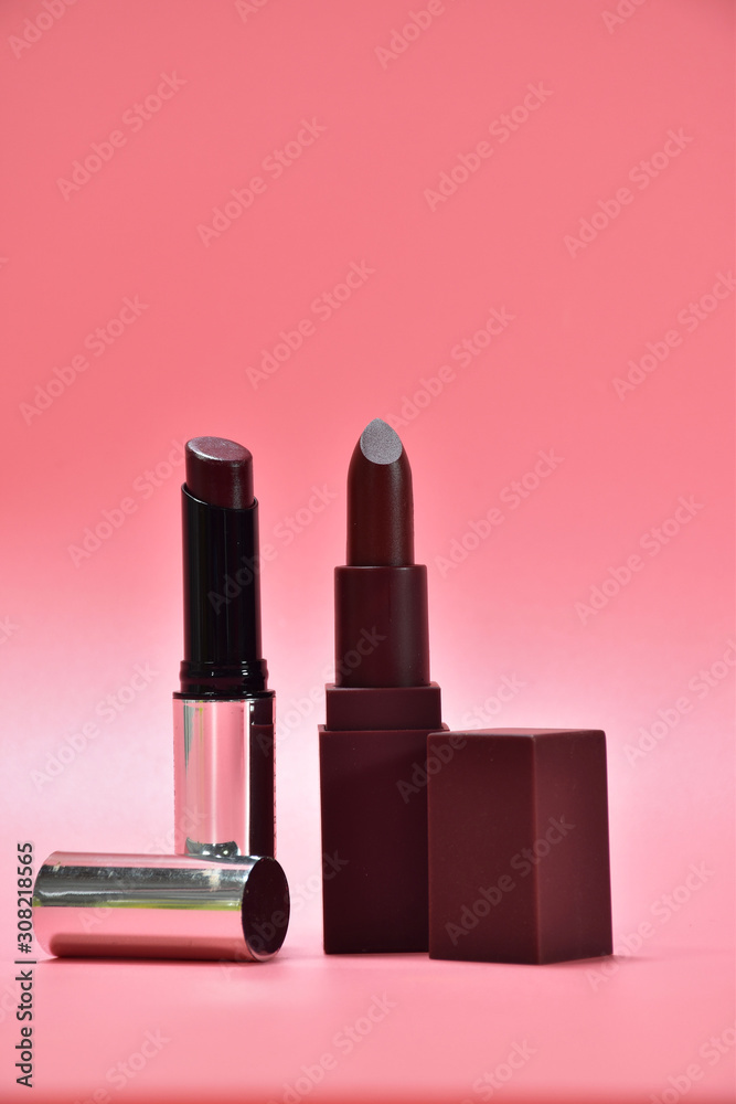 two lipstick on pink background two lipstick on pink background