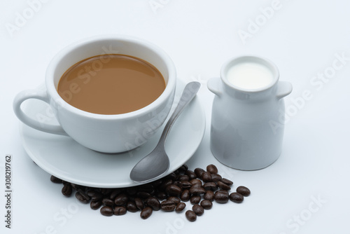 Milk coffee in a ceramic cup on a white background