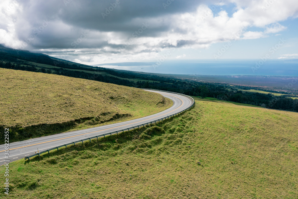Fototapeta premium Aerial view of winding road on a moody day