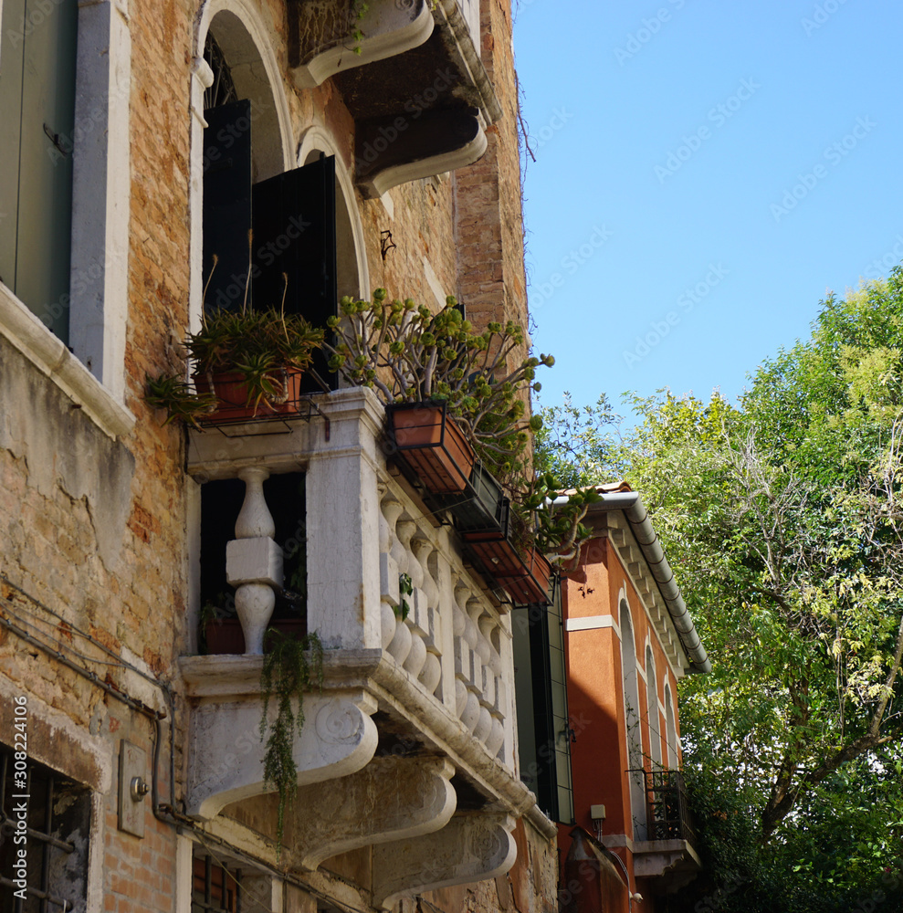 Ancient balcony with flower pots