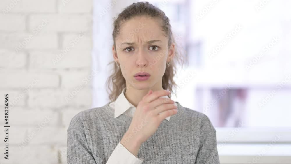 Portrait of Serious Young Latin Woman Feeling Shocked Portrait of Serious Young Latin Woman Feeling Shocked
