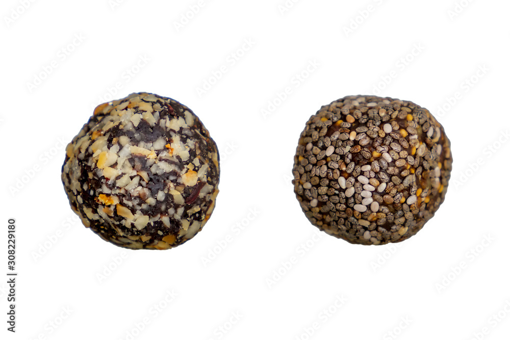 Healthy organic protein energy bites with nuts, cacao, banana, seeds and honey - sports food, vegetarian raw snack. Isolated Healthy organic protein energy bites with nuts, cacao, banana, seeds and honey - sports food, vegetarian raw snack. Isolated