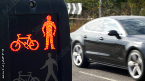 Pedestrian crossing red light over rural road in england uk
